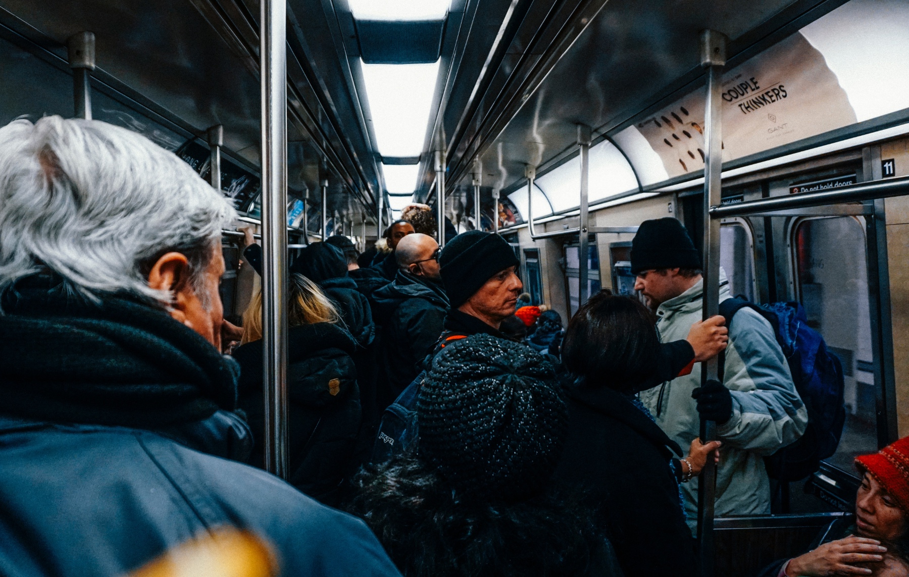 An image of a bunch of people crammed into a subway car