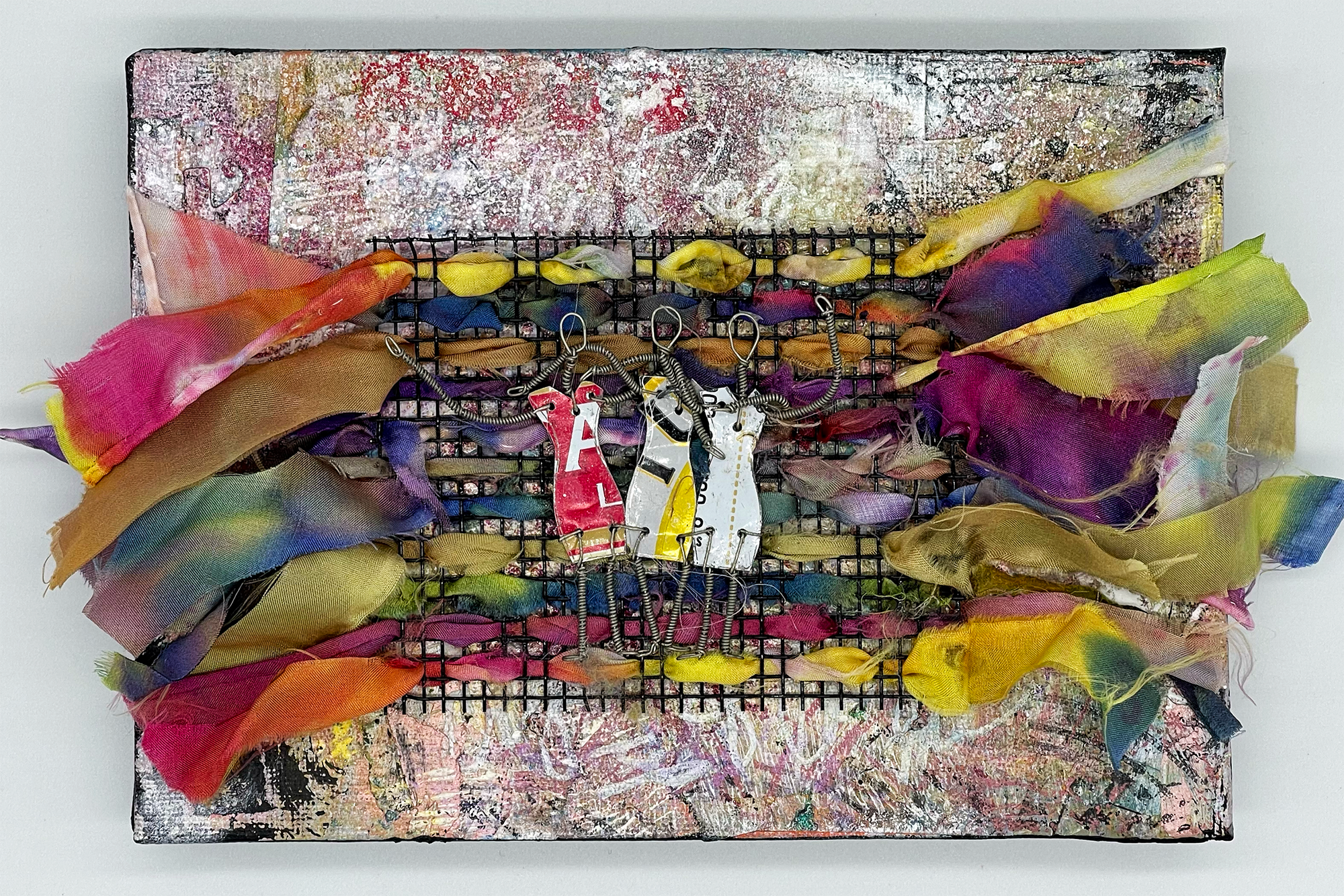"Three Friends" a mixed media painting by A.H. Lawver. A splattered background, with a 3D wire and textile sculpture on top, showing three ladies made of wire & recycled metal.