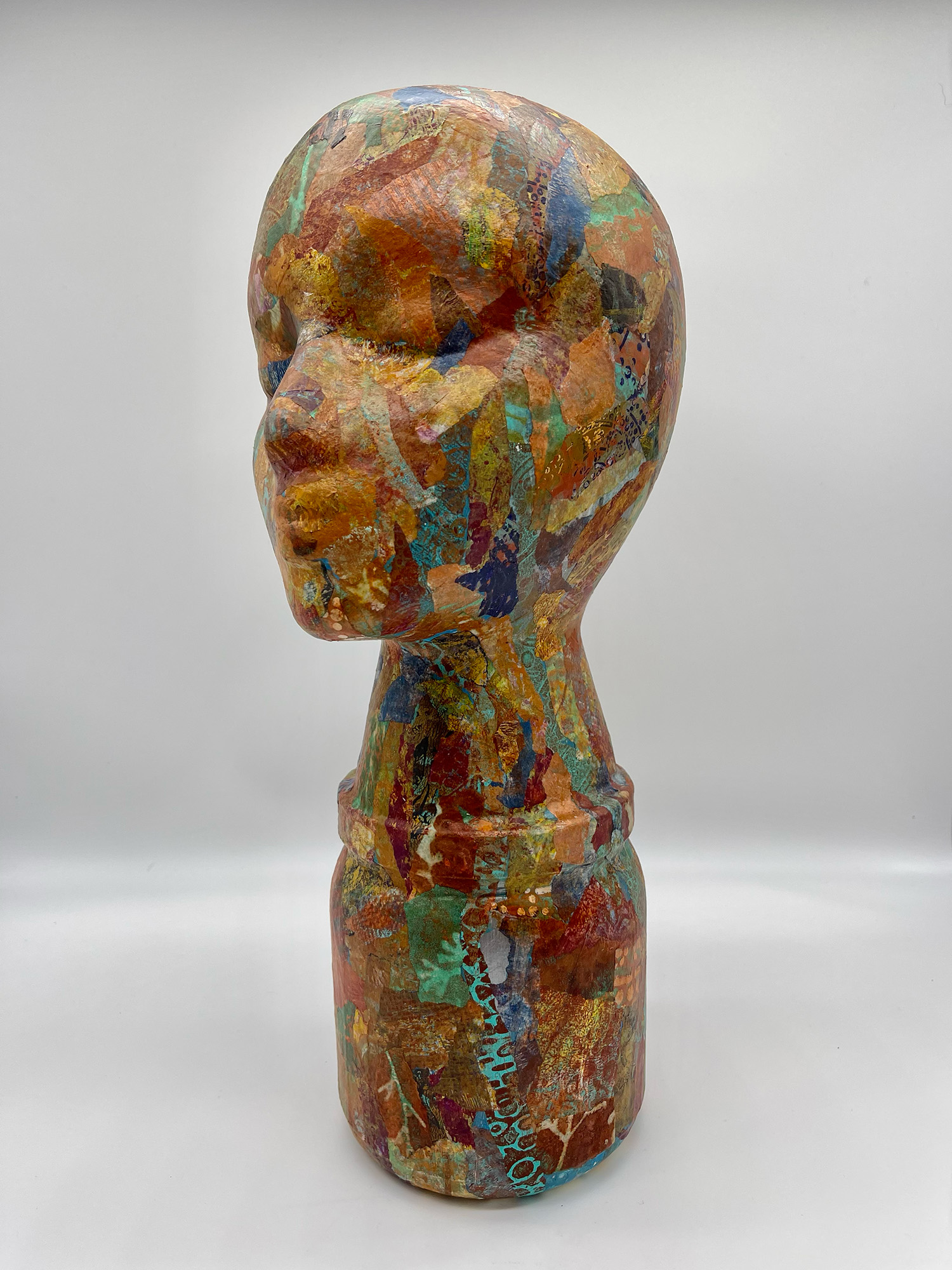 "Liv" by A.H. Lawver - a sculpture of a head, painted in wild & free splatterings of monoprints.
